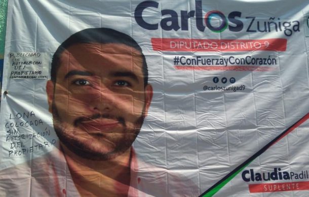Sin permiso, ponen lona de candidato en la barda de un comercio en Guadalajara